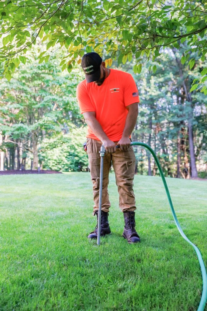 Marquis Tree Service employee performing deep root fertilization service