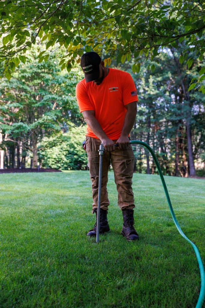 Marquis Tree Care employee performing deep root fertilization service